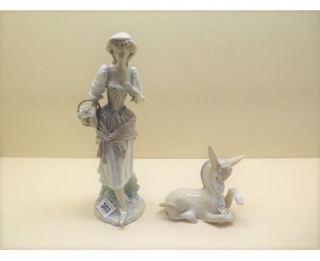 A Lladro lady with fruit basket (1970-1981) and a Lladro Donkey in love (1970) no 4524, both good 