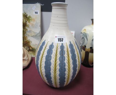 An Early 1950's Poole Pottery White Earthenware Carafe Vase, the blue and yellow stylised leaf design on alpine white glaze d