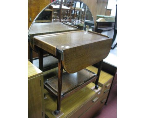 A 1920's Oak Tea Trolley, with fall leaves on chamfered legs. 