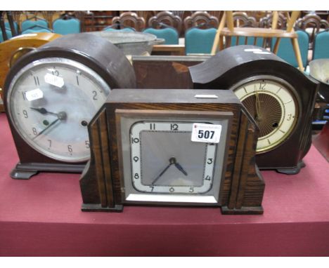 An Enfield Bakelite Cased Mantel Clock, a Smith's example missing glass, another in oak. (3)