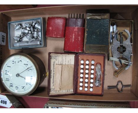 A Quantity of Watchmakers Accessories and Circular Clock Movement, with Arabic numerals to cream dial.