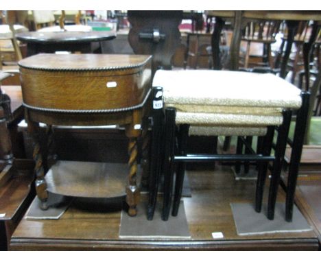 A 1920's Oak Sewing Table, with a hinged lid, fitted interior, on barley twist and block supports, with undershelf, together 