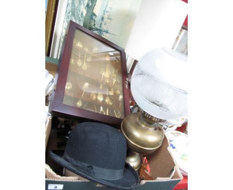 An Early XX Century Parafin Lamp, an Atlas Brand bowler hat, carved wooden cuckoo clock, metamec clocks, cased EPNS souvenir 