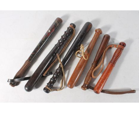 Six truncheons, one with remnants of paintwork, ranging from 38cm-26cm long. (6) No stamps present on pommels of the large tr