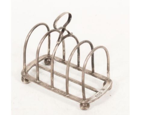 Victorian silver five bar toast rack with presentation inscription 'From Captain F J Carruthers 1898' by Goldsmiths &amp; Sil