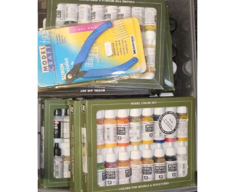 Acrylicos Vallejo of Spain, ten paint sets, each with 16 paints, boxed, and over sixty A K Interactive Xtreme Metal paints.