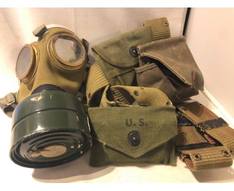 United States of America US army belt with two pouches, a further belt and canvas pouch and a gas mask.