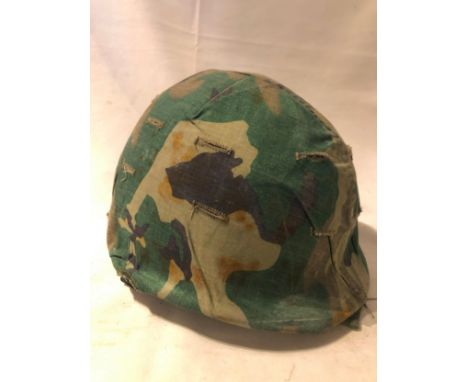 American M1 style steel helmet having camouflage cover, liner, canvas webbing, and leather headband.