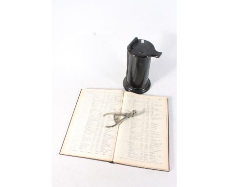 Railwayana to include a conductor's ticket clipper, a cast metal ticker date stamp machine and a Hand-Book of Stations 1956.(