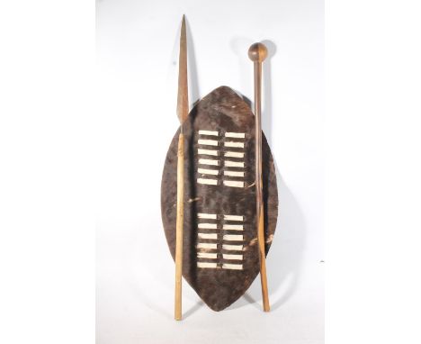 Zulu hide shield of typical form, a Zulu throwing spear and a large knobkerrie war club, 72cm, 96cm and 84cm long. (3)