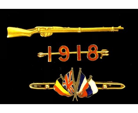 WW1 Gold Patriotic Brooches. 3 Examples. Comprising: Gold rifle embossed 9CT Length 6cm. ... Gold coloured metal bar brooch w