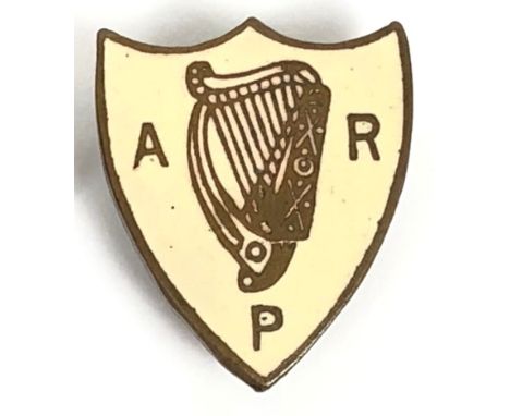 WW2 era Home Front Irish numbered ARP Badge.  A scarce brass and cream enamel shield shaped example bearing Harp between ARP,