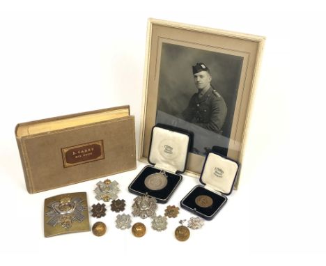 Highland Light Infantry Shoulder Belt Plate and Badges of Captain E Carey.  The items represent the 1930â€™s / WW2 period ser