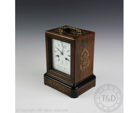 A 19th century French rosewood and marquetry inlaid mantel clock, with eight day movement striking on a bell, white enamel di