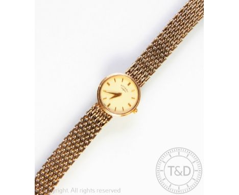 A lady's 9ct gold Rotary wristwatch, the champagne circular baton dial, with mesh link bracelet, in a Rotary box, 21gms gross