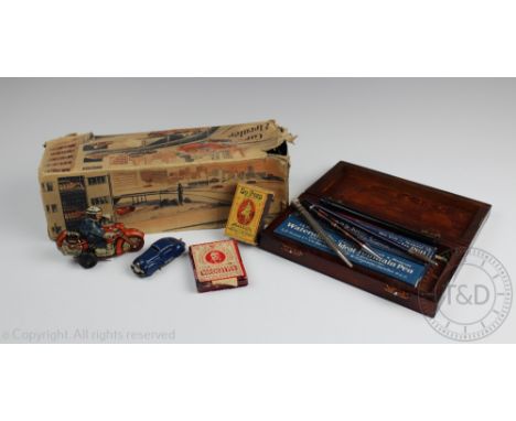 A German tin plate 'Car Elevator' with two original cars, stamped 'Made in US Zone, Germany', in original box, along with an 