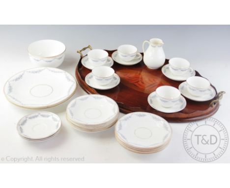 An Edwardian inlaid mahogany oval serving tray, with twin handles, 58.5cm, with a Victorian part tea service (Qty)