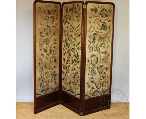 A late Victorian mahogany three bi-fold room screen, one side embroidered with birds and flowers, the other with golden uphol