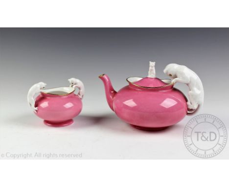 A Spode Copelands China novelty teapot and sugar bowl, the teapot modelled with a cat handle and cover with seated cat finial