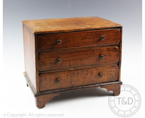A 19th century oak and pine apprentice chest, of three long drawers, on bracket feet, 25cm H x 32cm W x 21cm D