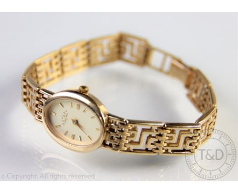 A lady's 9ct gold Rotary wristwatch, the champagne oval baton dial, with attached mesh link bracelet, 21gms gross   CONDITION