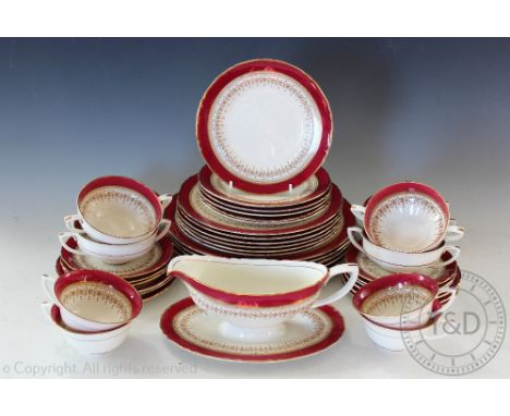 A late Victorian Royal Worcester 'Regency' dinner service comprising; six dinner plates, six side plates, six bread plates, s