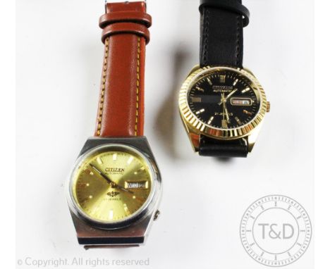 A Citizen automatic wristwatch, the black and gilt baton dial with centre sweep seconds and subsidiary calendar dial, numbere
