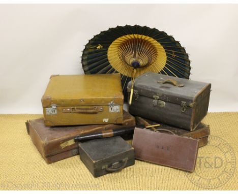 Three vintage tan leather cases, with a canvas case with label for J. W. Franck of Frankfurt, a smaller leather case, two Jap