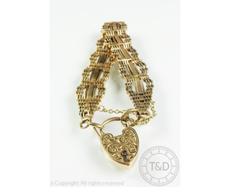 A Victorian yellow gold bracelet, the decorative bracelet designed as bar links, with attached padlock clasp stamped 'J.G & S