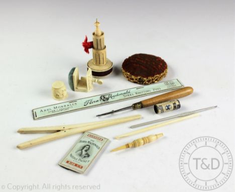 A selection of Victorian and later carved sewing tools to include; a combination bone pin cushion and tape measure, modelled 