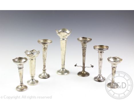 A selection of seven silver posy vases to include a large George V example, William Devenport, Birmingham 1932, with lobed ri