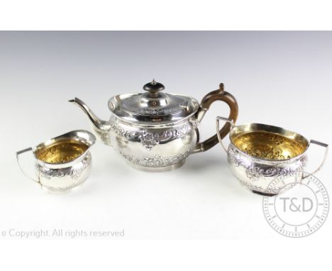 An Edwardian silver three piece service, C S Harris & Sons Ltd, London 1905, comprising; a teapot, 14cm high, a twin handled 