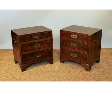 A pair of modern Campaign style walnut bedside chests, on three graduated drawers, on bracket feet, 59cm H x 56cm W nx 41cm D