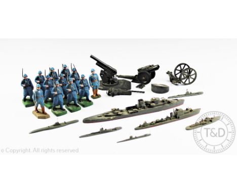 A collection of twelve early 20th century French painted composition toy soldiers, modelled in World War One Poilu uniform, t