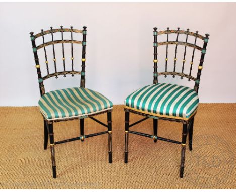 A pair of 19th century Aesthetic chairs, gilt decorated ebonised spindle frames, on turned legs, (2)   CONDITION REPORT:  One