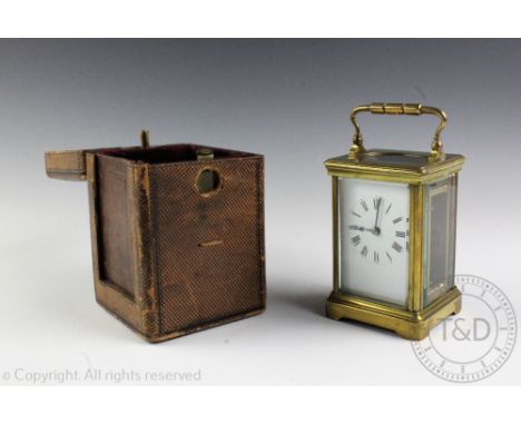 A French brass carriage timepiece, early 20th century, the lacquered brass case enclosing a single fusee movement, with black