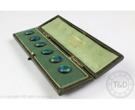 A set of six enamel buttons,  each planished and enamelled in blue and green tones, each 1.1cm diameter, unmarked, in a fitte