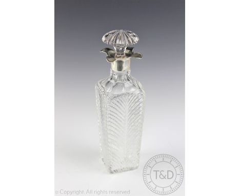 An Edwardian cut glass silver mounted decanter and stopper, Thomas Latham & Ernest Morton, Birmingham 1910, the tall tapered 