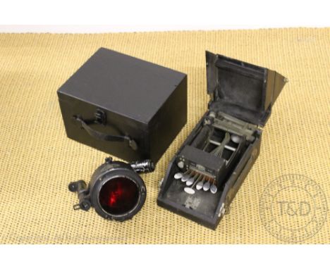 An Aldis type signalling lamp, stamped AM, >Ref No 5A/1152, in ebonised box, with a Matrix Model F No 1466 type writer for th