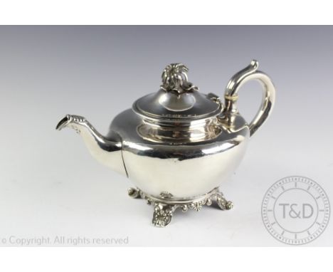 A Victorian silver tea pot, Joseph & John Angell London 1839, with flower head finial and ivory insulators, the underside eng