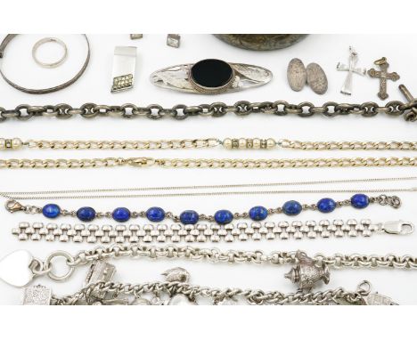 A GROUP OF MOSTLY SILVER JEWELLERY (16)Comprising; a watch Albert chain, an oval hinged bangle, a charm bracelet, three furth