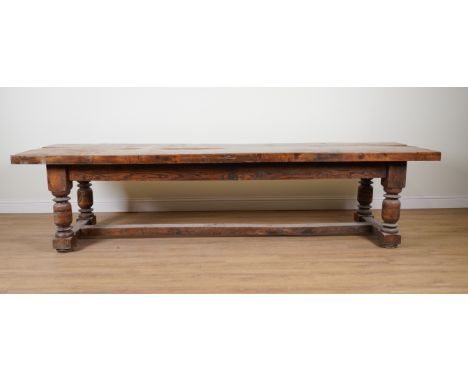 A 17TH CENTURY STYLE OAK REFECTORY TABLEThe three inch triple plank top on turned supports, 326cm long; 92cm wide; 82cm highC
