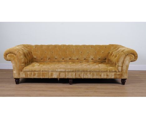 GEORGE SMITH; A BUTTON BACK GOLD UPHOLSTERED CHESTERFIELD SOFAOn six turned supports, 257cm wide; 72cm highProvenance: A Hous