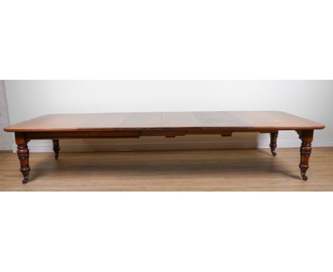 A VICTORIAN MAHOGANY EXTENDING DINING TABLEWith four extra leaves, 138cm wide; 187cm long; 393cm long fully extendedCondition