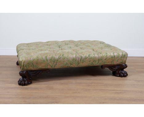 A LARGE GREEN FLORAL BUTTON UPHOLSTERED RECTANGULAR STOOLOn carved hardwood lion's paw feet, 150cm wide; 110cm deep; 35cm hig