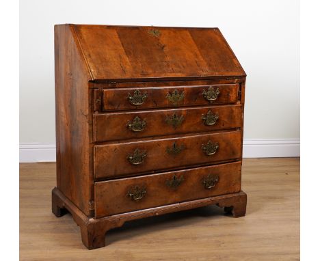 AN 18TH CENTURY WALNUT BUREAUThe fall enclosing a fitted interior, over four long drawers on bracket feet, 92cm wide; 106cm h