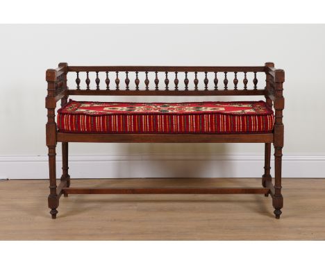 A 19TH CENTURY FRENCH STAINED BEECH SQUARE BACK HALL BENCHWith bobbin turned over fluted supports, 120cm wide; 44cm deep; 80c