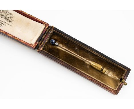 A VICTORIAN SAPPHIRE AND DIAMOND STICK PINSet with a cushion shaped sapphire and with an old cut diamond, unmarked, gross wei