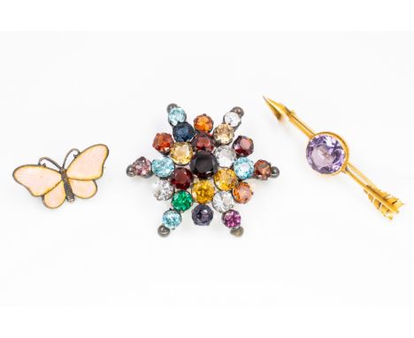 AN EDWARDIAN AMETHYST BROOCH AND TWO FURTHER BROOCHES (3)Comprising; a gold and amethyst single stone brooch, designed as an 