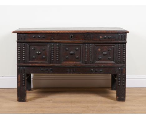 A 17TH CENTURY CENTURY OAK COFFERWith split bobbin turned decoration, 124cm wide; 52cm deep; 80cm high